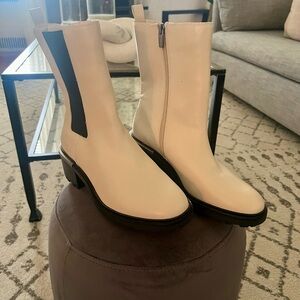 Vince Camuto cream colored boots.